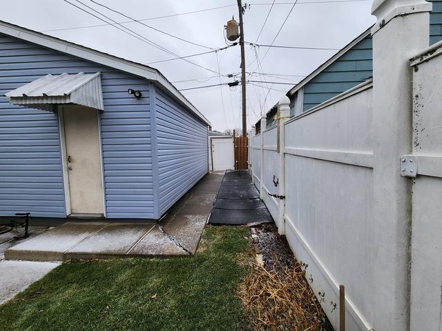 view of property exterior featuring fence