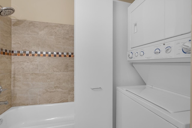 washroom with stacked washing maching and dryer and laundry area