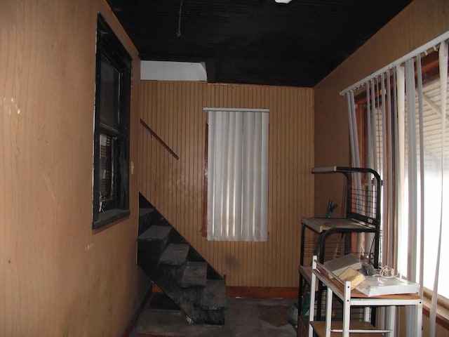 interior space featuring wood walls