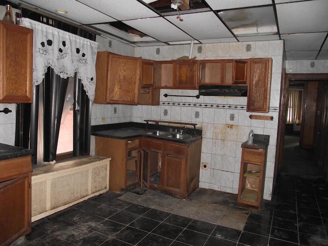 kitchen with dark countertops and brown cabinets