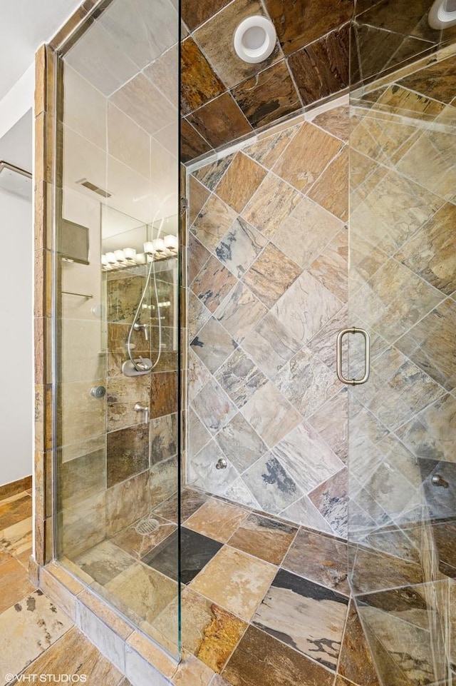 full bathroom featuring a shower stall