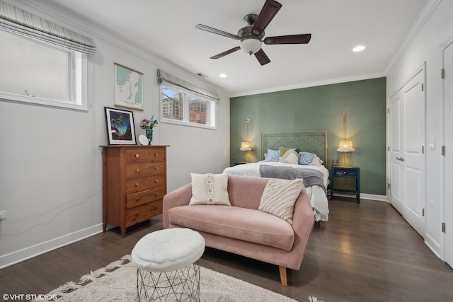 bedroom featuring ornamental molding, baseboards, and wood finished floors