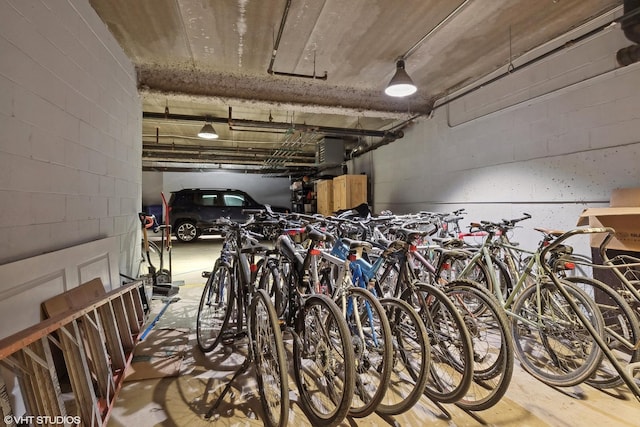 garage with bike storage and concrete block wall