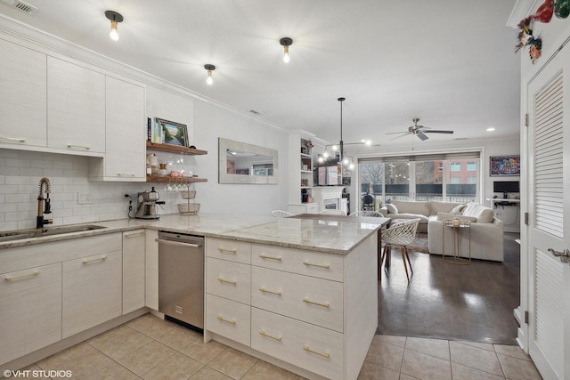 kitchen featuring a sink, crown molding, a peninsula, light tile patterned flooring, and open shelves