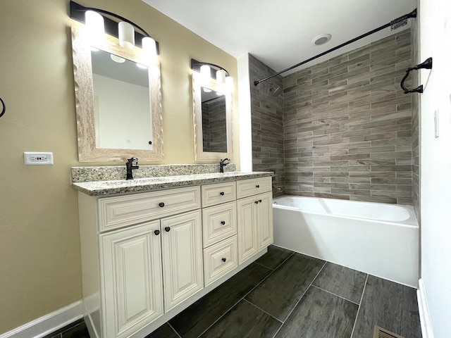 bathroom with double vanity, wood tiled floor, tub / shower combination, and a sink