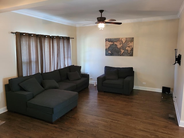 living area featuring ornamental molding, dark wood finished floors, a ceiling fan, and baseboards