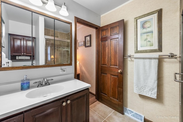 full bath featuring vanity, a shower stall, visible vents, and tile patterned floors