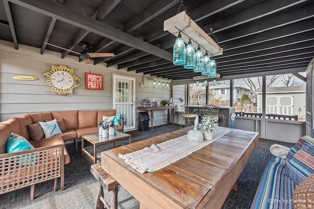 wooden terrace featuring a storage shed, grilling area, outdoor lounge area, and an outbuilding