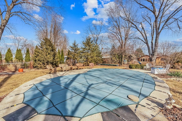 view of swimming pool with a patio, fence, and a fenced in pool