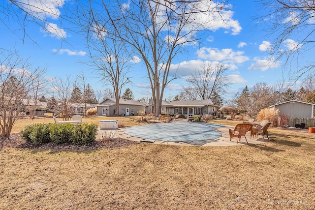 view of yard with a fenced in pool, a patio area, and fence