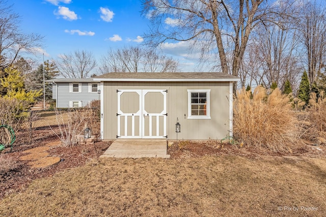 view of shed with fence