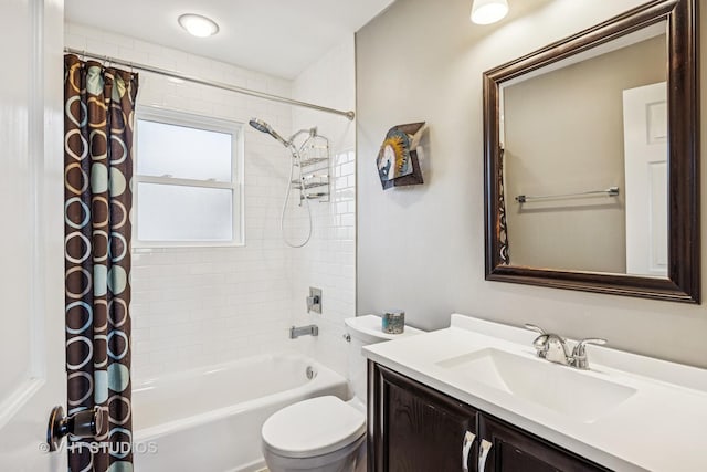 full bath featuring shower / tub combo, vanity, and toilet