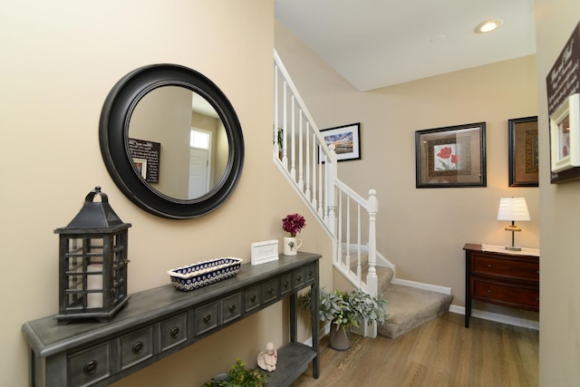 interior space with recessed lighting, stairway, baseboards, and wood finished floors