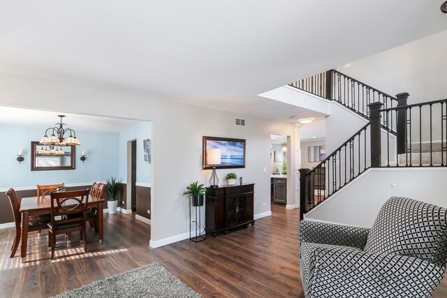 kitchen with dark wood-style flooring, light countertops, decorative backsplash, open floor plan, and dishwasher