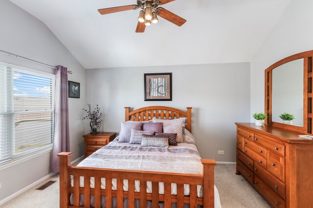 bedroom featuring baseboards, vaulted ceiling, and light colored carpet