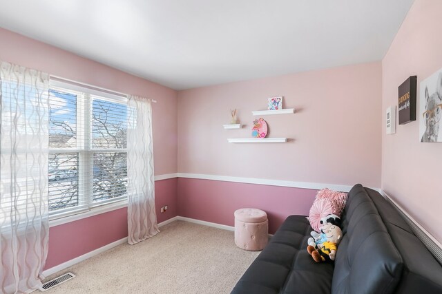 bedroom featuring baseboards, visible vents, a closet, and light colored carpet