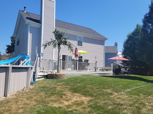 wooden deck featuring a residential view and fence private yard