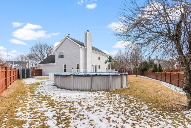 traditional-style home with aphalt driveway, an attached garage, and fence