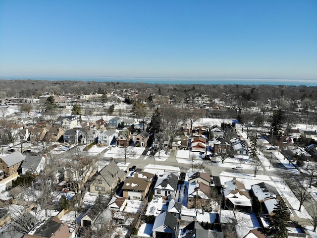 snowy aerial view featuring a residential view