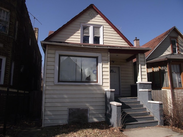 bungalow featuring a porch and fence