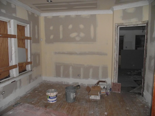 unfurnished room with crown molding