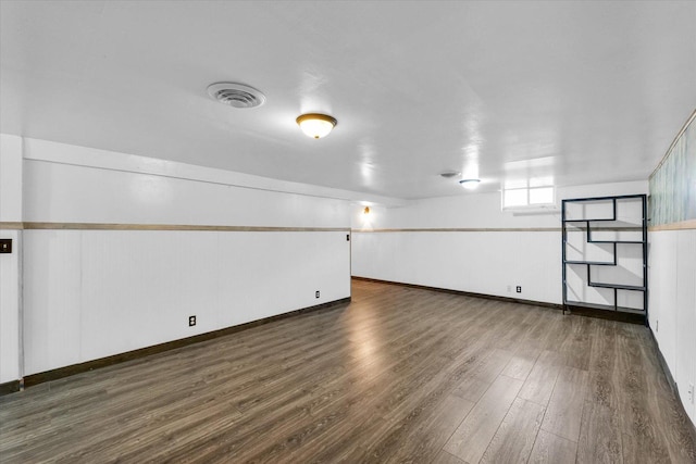 interior space featuring visible vents and wood finished floors