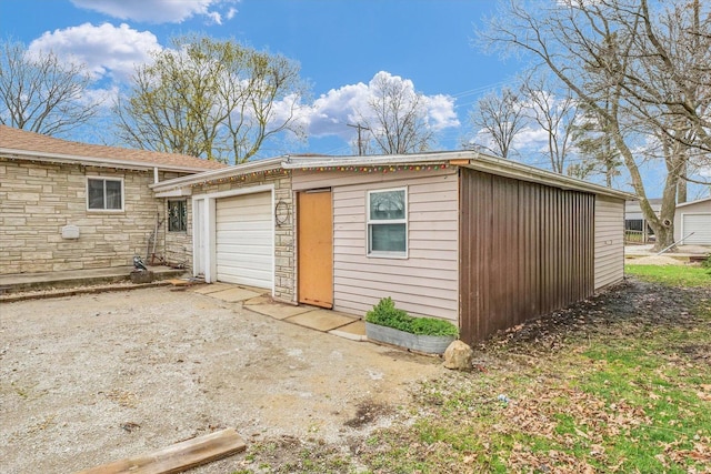 view of outdoor structure with driveway
