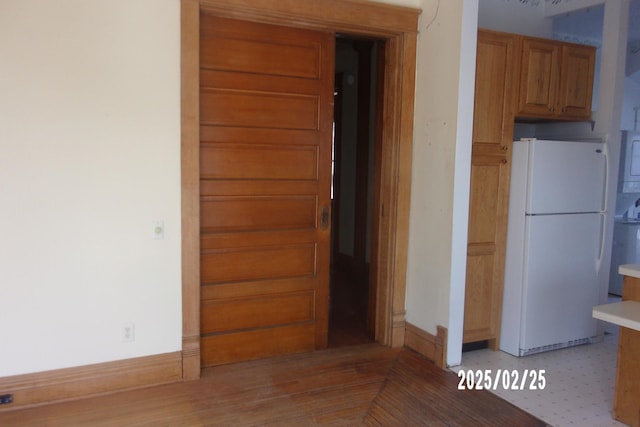 hallway featuring baseboards