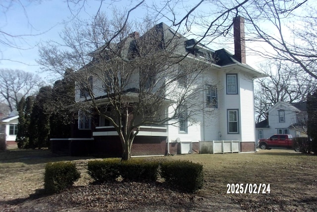 exterior space featuring a chimney