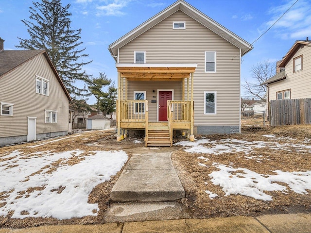 view of front of property featuring fence