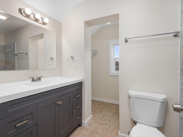full bathroom with lofted ceiling, toilet, vanity, tile patterned flooring, and baseboards