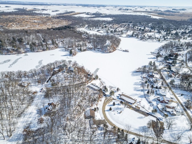 snowy aerial view with a residential view