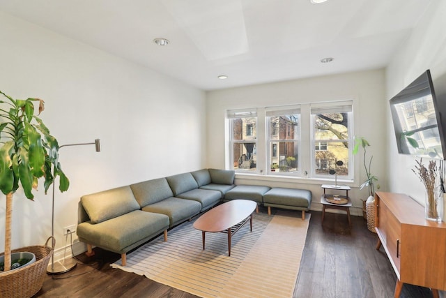 living area with recessed lighting and dark wood finished floors