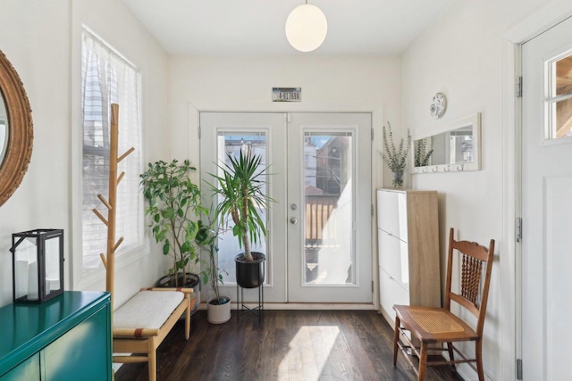 doorway to outside with french doors and wood finished floors