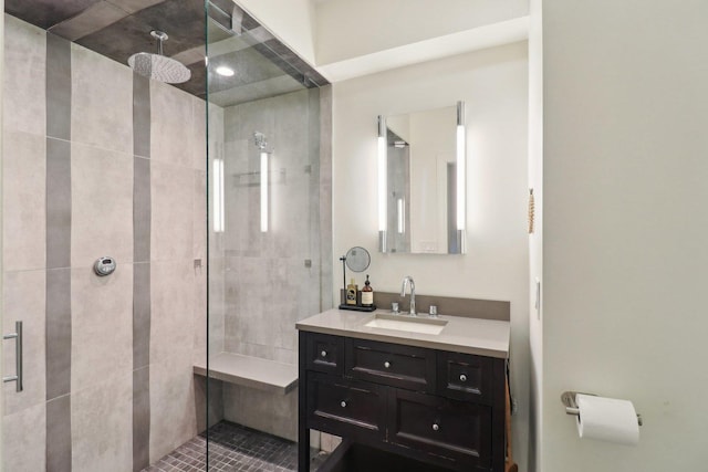 bathroom featuring a stall shower and vanity