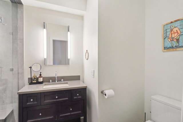 bathroom featuring vanity and toilet