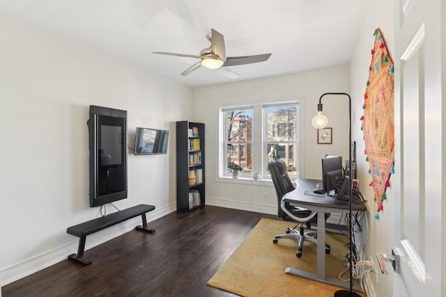 office featuring ceiling fan, baseboards, and wood finished floors