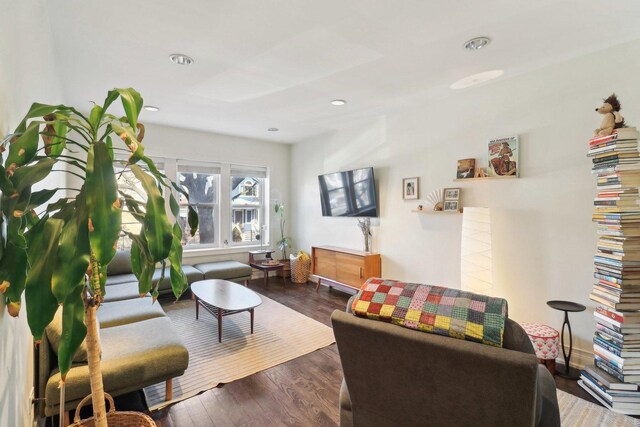 living room with wood finished floors and recessed lighting