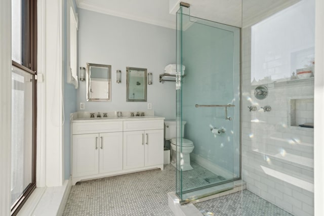 bathroom featuring crown molding, a stall shower, tile patterned floors, and a sink