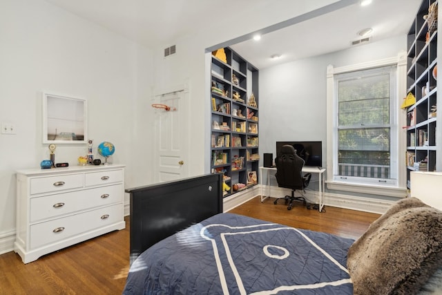 bedroom featuring recessed lighting, visible vents, baseboards, and wood finished floors