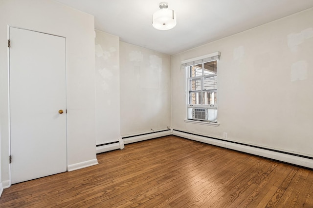 empty room with cooling unit and hardwood / wood-style flooring