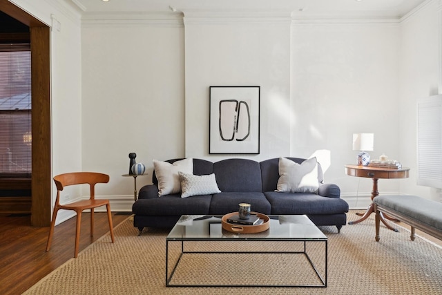 living room with wood finished floors, baseboards, and ornamental molding