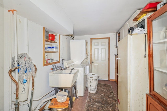 laundry area featuring washer / clothes dryer, a sink, and laundry area