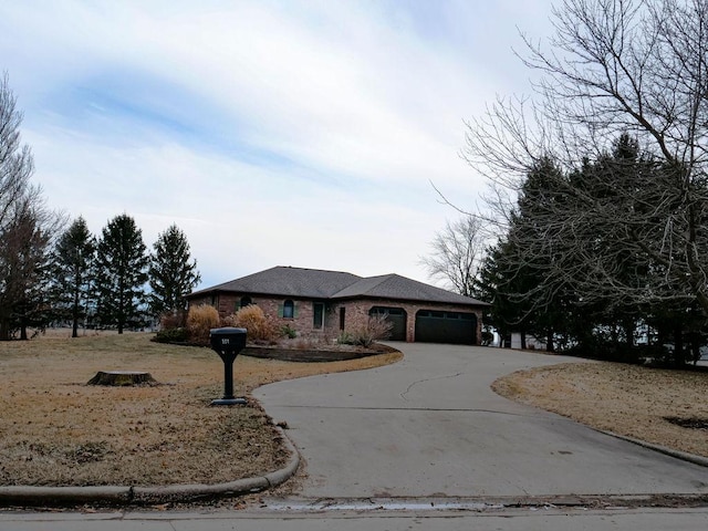 view of front facade featuring an attached garage and driveway