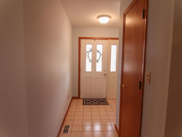 entryway featuring visible vents, baseboards, and light tile patterned flooring