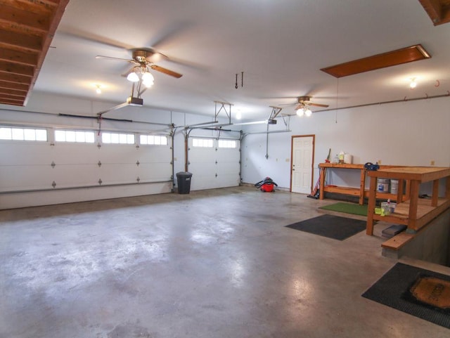 garage with a ceiling fan and a garage door opener