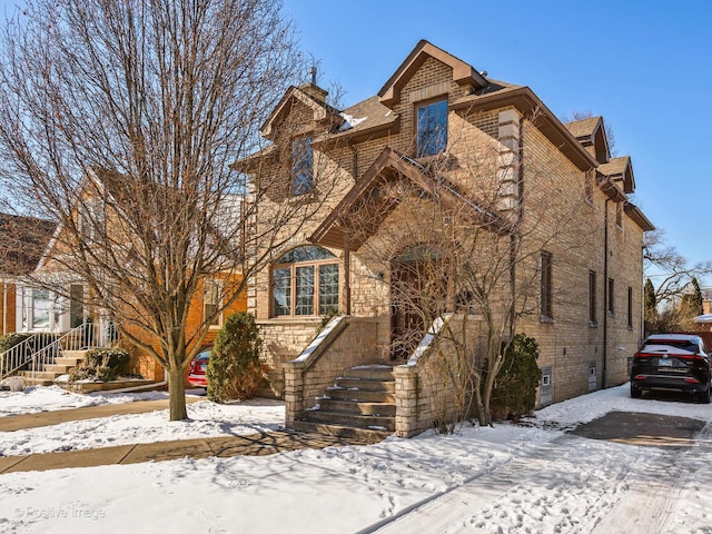 view of front of home featuring brick siding