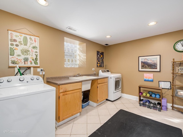 laundry area with light tile patterned floors, washer and clothes dryer, cabinet space, and recessed lighting