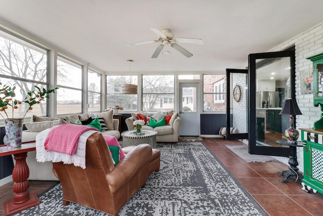 sunroom / solarium with ceiling fan