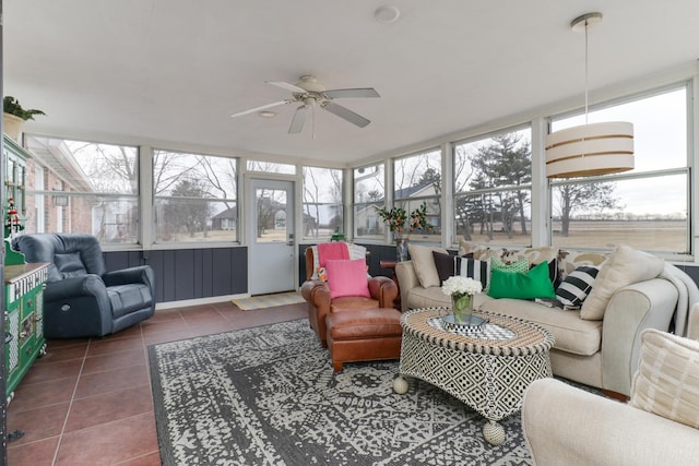 sunroom / solarium with plenty of natural light and a ceiling fan